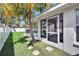 Lush backyard features a screened-in pool, well-maintained lawn and tropical landscaping at 3505 Kilmer Dr, Plant City, FL 33566