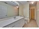 Bright bathroom featuring a white vanity, with an adjacent shower and toilet at 3505 Kilmer Dr, Plant City, FL 33566