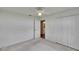 This bedroom has a ceiling fan and a view into the adjacent bathroom at 3505 Kilmer Dr, Plant City, FL 33566