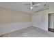 Bright bedroom features a ceiling fan, double closet and neutral walls and carpet at 3505 Kilmer Dr, Plant City, FL 33566
