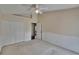 Spacious bedroom features a ceiling fan, carpet floors, and double-door closet at 3505 Kilmer Dr, Plant City, FL 33566
