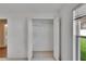 Open closet with shelving units and view into a well-lit bathroom at 3505 Kilmer Dr, Plant City, FL 33566