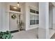 Inviting front porch with decorative wreath, large windows and tiled flooring at 3505 Kilmer Dr, Plant City, FL 33566