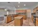 Well-equipped kitchen with stainless steel appliances, granite countertops, and a practical island at 3505 Kilmer Dr, Plant City, FL 33566