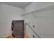 The laundry room includes washer, dryer and metal shelving unit for ample storage at 3505 Kilmer Dr, Plant City, FL 33566