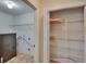 The laundry room includes washer hookups and wire shelving units for storage at 3505 Kilmer Dr, Plant City, FL 33566