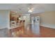 Open concept living room and kitchen with hardwood floors and natural lighting at 3505 Kilmer Dr, Plant City, FL 33566