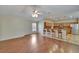 Bright and airy living room with hardwood flooring leading into the kitchen at 3505 Kilmer Dr, Plant City, FL 33566