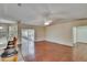 Spacious living room with hardwood flooring, ceiling fan, and sliding glass door at 3505 Kilmer Dr, Plant City, FL 33566