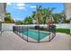 Private pool enclosed by a safety fence, ensuring a secure and enjoyable outdoor experience at 3505 Kilmer Dr, Plant City, FL 33566