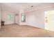 Spacious bedroom featuring carpet flooring, ceiling fan, and natural lighting at 3545 E Lake Dr, Land O Lakes, FL 34639