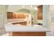 Open kitchen with light countertops, stainless steel appliances, and wood cabinets at 3545 E Lake Dr, Land O Lakes, FL 34639