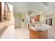 Bright kitchen featuring tile flooring, light countertops and cabinets, and stainless appliances at 3545 E Lake Dr, Land O Lakes, FL 34639