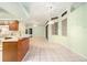 Spacious kitchen featuring tile flooring, light countertops, and stainless steel appliances at 3545 E Lake Dr, Land O Lakes, FL 34639