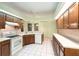 Bright kitchen featuring tile flooring, ample wood cabinets, and modern appliances at 3545 E Lake Dr, Land O Lakes, FL 34639