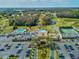 A stunning aerial view of the golf and country club, showcasing the community's pool, and greens at 3681 Trophy Blvd # 6, New Port Richey, FL 34655
