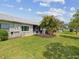 Lush backyard with well-maintained lawn, landscaping and mature trees providing privacy at 3681 Trophy Blvd # 6, New Port Richey, FL 34655