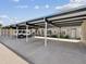Covered carport featuring ample parking spaces and beautiful landscaping at 3681 Trophy Blvd # 6, New Port Richey, FL 34655
