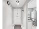 Bright entryway featuring a clean design and a view into the modern kitchen at 3681 Trophy Blvd # 6, New Port Richey, FL 34655
