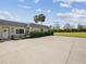Well-maintained home exterior with lush landscaping and a spacious driveway at 3681 Trophy Blvd # 6, New Port Richey, FL 34655