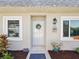 Close-up of the home's front door, showcasing its welcoming entrance and charming details at 3681 Trophy Blvd # 6, New Port Richey, FL 34655