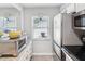 Bright kitchen featuring modern appliances and a view through the window at 3681 Trophy Blvd # 6, New Port Richey, FL 34655
