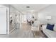 Open-concept living area offering natural light, comfortable seating, and mirrors for added depth at 3681 Trophy Blvd # 6, New Port Richey, FL 34655