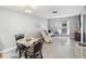 Cozy living room featuring a dining area, comfortable seating, and sliding glass doors to the outside at 3681 Trophy Blvd # 6, New Port Richey, FL 34655