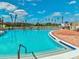 Enjoy a large sparkling pool surrounded by palm trees and lounge chairs perfect for relaxation at 3681 Trophy Blvd # 6, New Port Richey, FL 34655