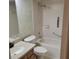 Neutral bathroom with tiled shower/tub and coordinating vanity at 38243 Ironwood Pl, Zephyrhills, FL 33542