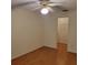 Bedroom with hardwood floors and an open closet at 38243 Ironwood Pl, Zephyrhills, FL 33542