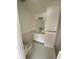 Classic bathroom with a vanity, mirror, and tiled walls and floor at 4518 Narraganset Trl # 85A, Sarasota, FL 34233