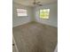 This room features two windows to bring in natural light and plush carpeting at 4518 Narraganset Trl # 85A, Sarasota, FL 34233