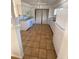 Spacious kitchen features white appliances, ample storage, and tiled flooring at 4518 Narraganset Trl # 85A, Sarasota, FL 34233