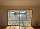 Enclosed lanai featuring sliding glass doors with gorgeous lake views and natural light at 4518 Narraganset Trl # 85A, Sarasota, FL 34233
