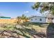 Spacious fenced backyard with a mix of grass and shaded areas at 4568 67Th N St, St Petersburg, FL 33709