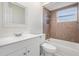 Bathroom featuring tiled shower and tub, with a white vanity at 4568 67Th N St, St Petersburg, FL 33709