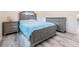 Comfortable bedroom with wood-look flooring and calm color palette, perfect for relaxing at 4568 67Th N St, St Petersburg, FL 33709