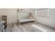 Bedroom with bunk beds, light gray wood-look floors, and natural light at 4568 67Th N St, St Petersburg, FL 33709
