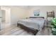 Neutral bedroom with wood-look floors, ceiling fan and simple design for comfort at 4568 67Th N St, St Petersburg, FL 33709