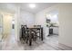 Cozy dining area with modern accent wall, adjacent to the kitchen and connecting hallway at 4568 67Th N St, St Petersburg, FL 33709