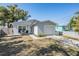 Charming home with a well-maintained lawn, driveway, and covered porch at 4568 67Th N St, St Petersburg, FL 33709