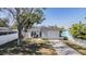 Charming home with a well-maintained lawn, driveway, and covered porch at 4568 67Th N St, St Petersburg, FL 33709