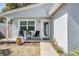 Inviting front porch seating area, perfect for relaxing outside the single-story home at 4568 67Th N St, St Petersburg, FL 33709