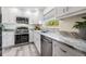 Modern kitchen features stainless steel appliances, sleek countertops, and ample cabinet space at 4568 67Th N St, St Petersburg, FL 33709