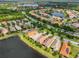 Aerial view of a residential community with lakes, lush landscaping, and well-maintained homes at 4811 Sandy Glen Way, Wimauma, FL 33598