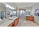 Spacious bathroom with dual vanities, and walk-in shower at 4811 Sandy Glen Way, Wimauma, FL 33598
