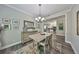 Cozy dining room with rustic furniture and a view into the kitchen at 4811 Sandy Glen Way, Wimauma, FL 33598