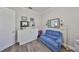 Versatile room featuring hardwood floors, a murphy bed, and neutral paint at 4811 Sandy Glen Way, Wimauma, FL 33598