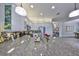 Modern kitchen featuring granite countertops, stainless steel appliances, and decorative tile backsplash at 4811 Sandy Glen Way, Wimauma, FL 33598